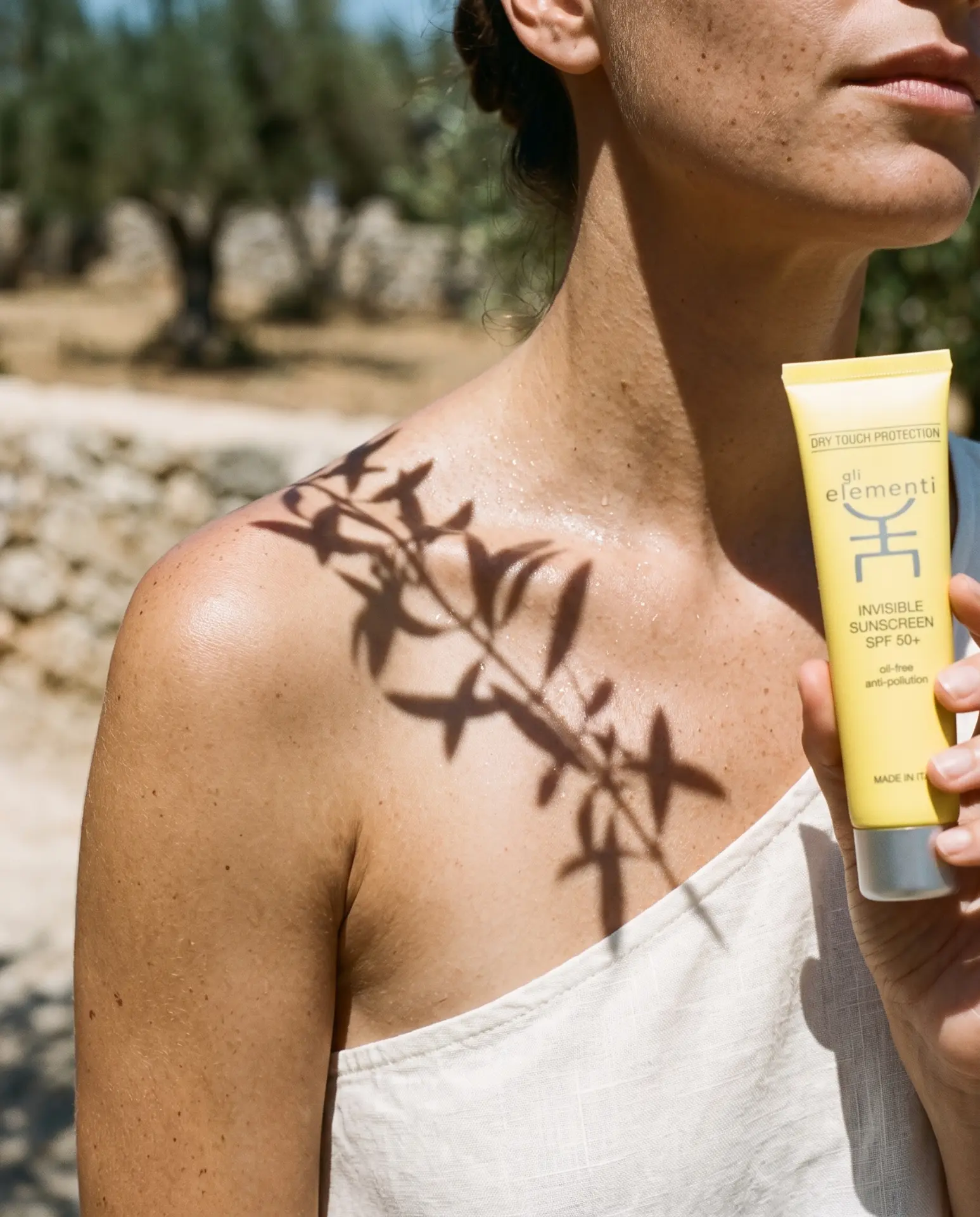 Gli Elementi campaign creative — Invisible Sunscreen SPF 50+ in olive grove light